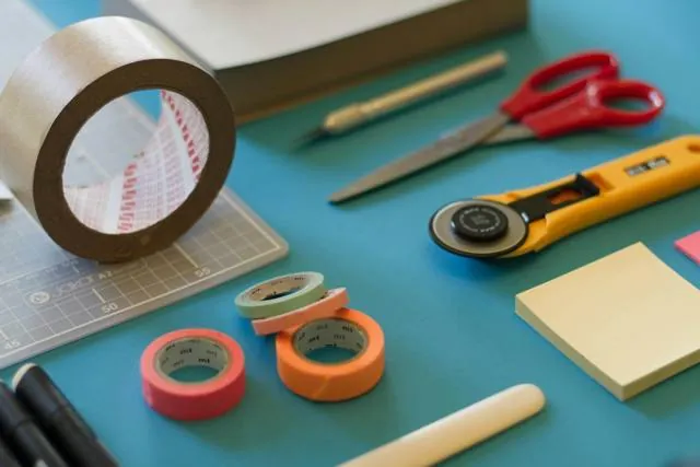 Craft tools and tape on a cutting mat